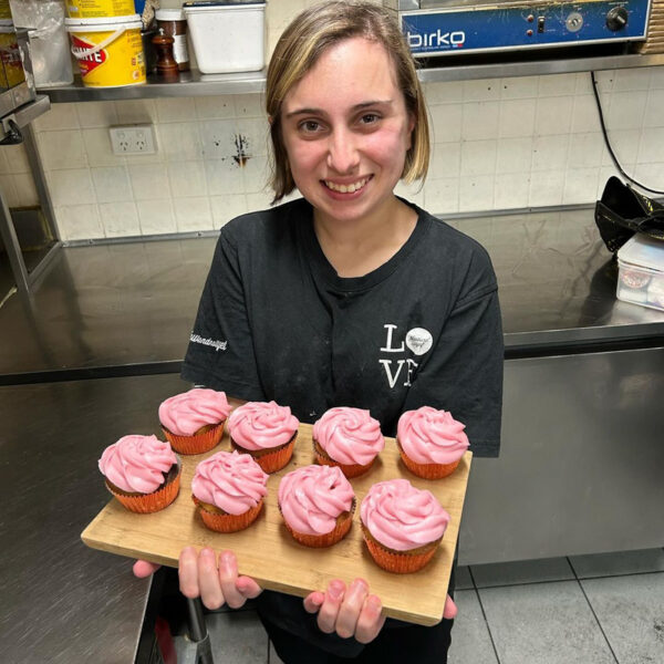 Alkira participant Johana presents her pretty pink cupcakes.