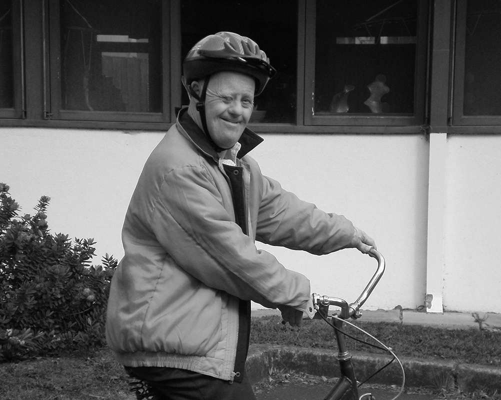 A photo of the late Bruce Gook on his bicycle.