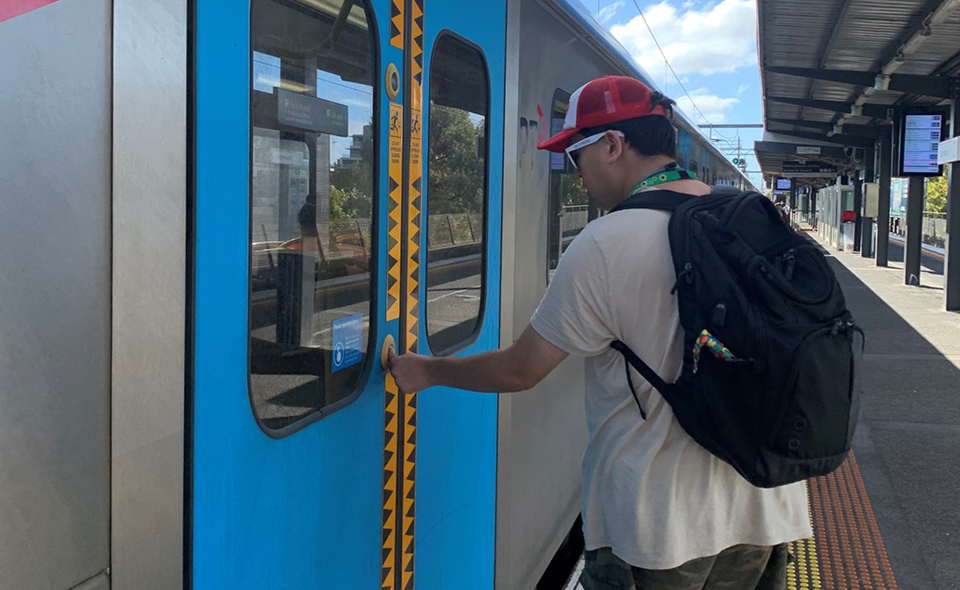Alkira Momentum participant gets on train.