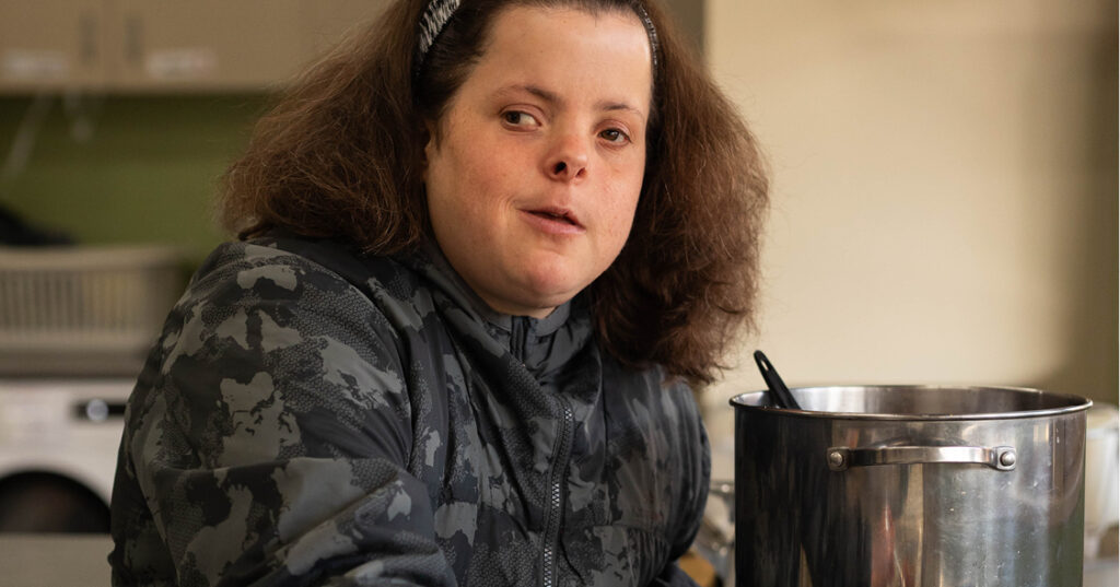 Alkira participant Rebecca making soup on the stovetop.