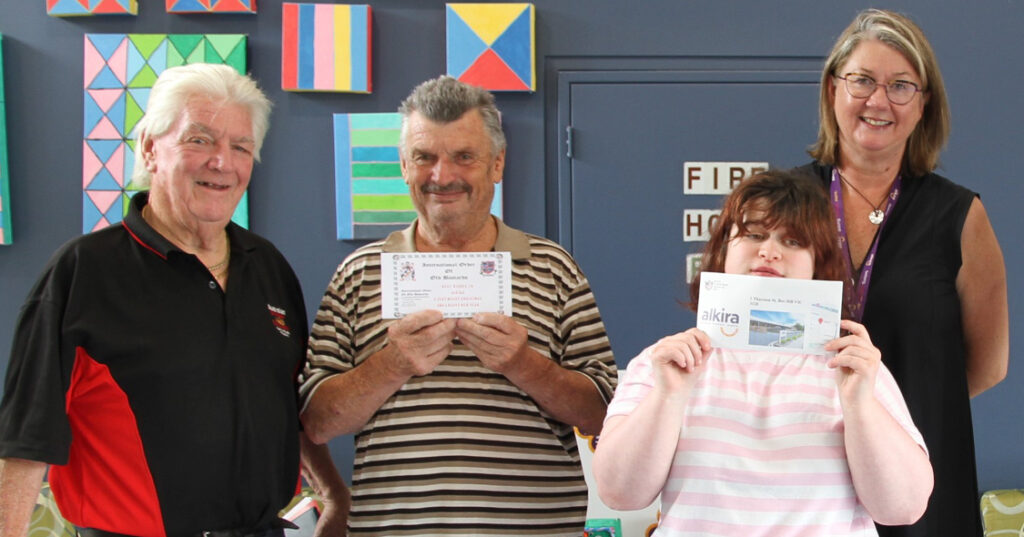 Alkira supporter IOOB President Arthur Ritchie with brother Alkira participant John Ritchie presenting Alkira CEO Julia a cheque,