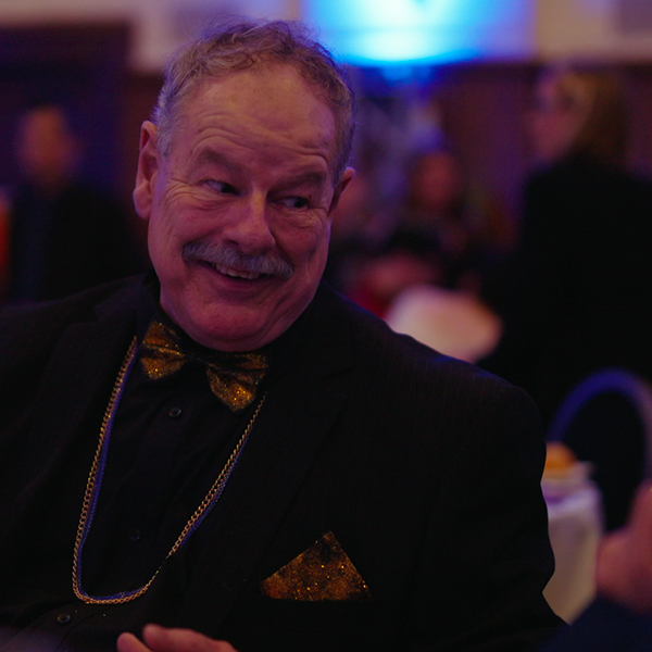Longstanding Alkira staff member Dean enjoying dinner at the Alkira 70th anniversary gala.