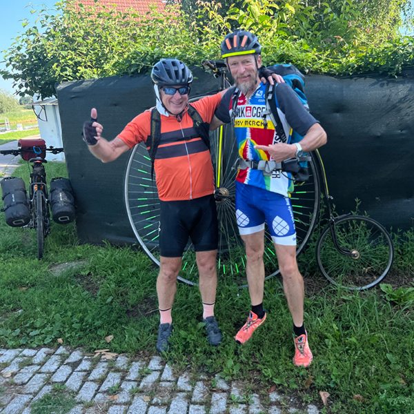 Peter with a friend he made on his cycling trip across the alps.
