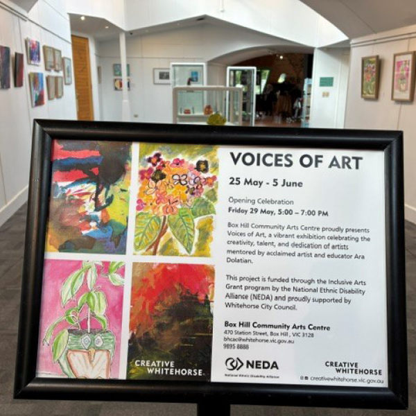 A photo of the entry to the Voices of Art Exhibition at the Box Hill Community Arts Centre. You can see the gallery in the background and the foreground shows the gallery signage.